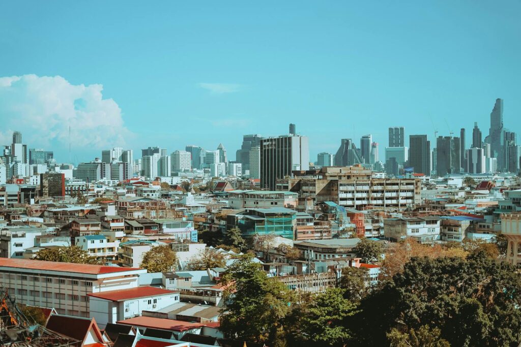 A vibrant view of Bangkok's skyline, showcasing a mix of modern and traditional architecture.